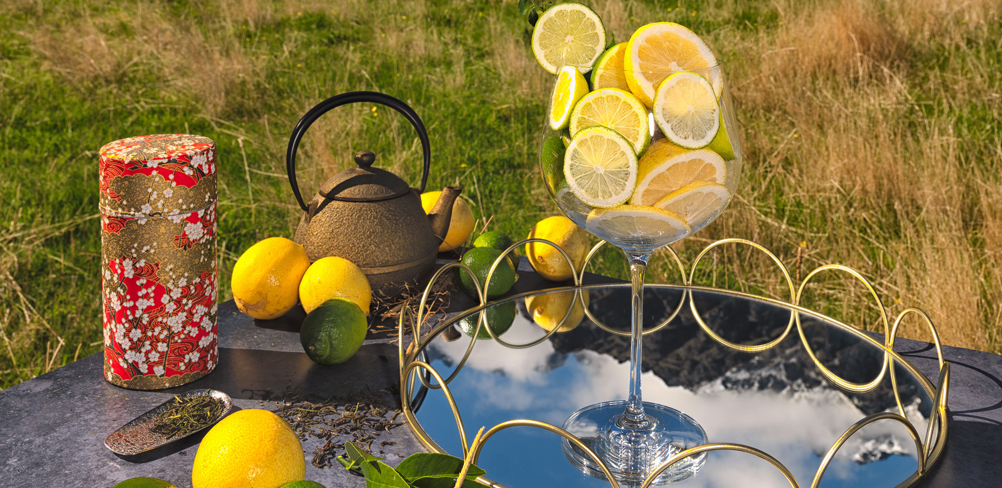 Drift Gin Banner image of Glass filled with lemons and limes