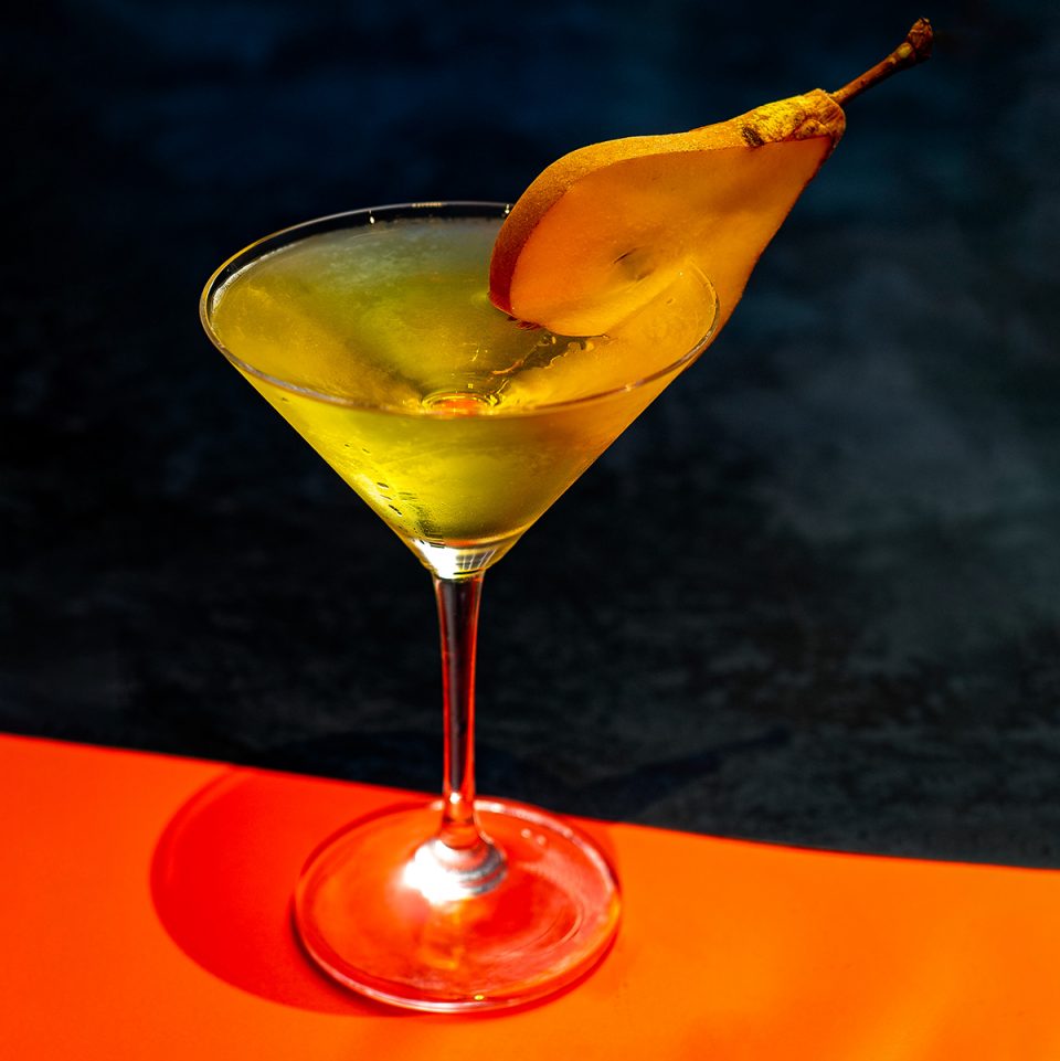 Drift Autumn Aperitif cocktail with a pear garnish